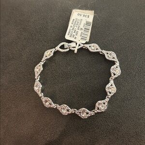 Elegant Ladies Silver Toned 7.5 “ Bracelet with Diamond Like Clear Accents